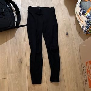 Black leggings with seam and zipper on the back
